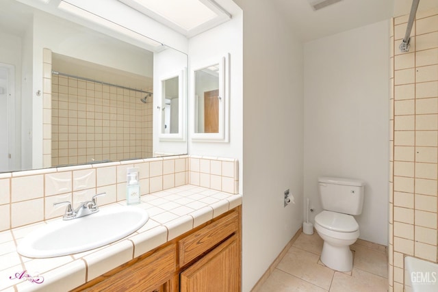 full bathroom with tasteful backsplash, a shower, toilet, tile patterned floors, and vanity