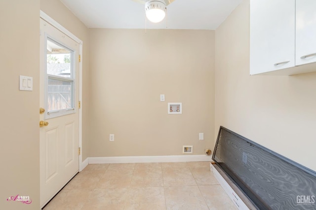 laundry room with cabinet space, baseboards, light tile patterned floors, and washer hookup