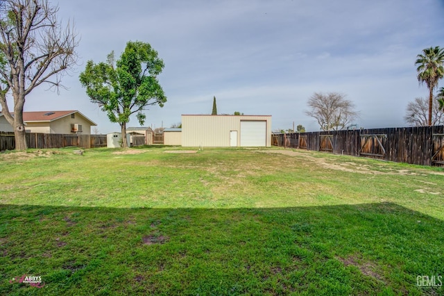 view of yard with a fenced backyard and an outdoor structure