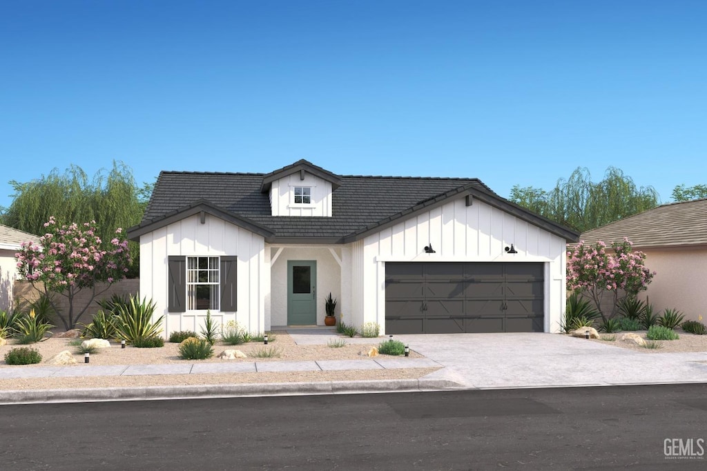 modern inspired farmhouse with a garage, concrete driveway, board and batten siding, and a tile roof