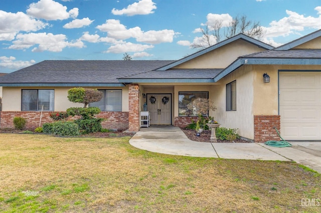 single story home featuring a garage and a front lawn