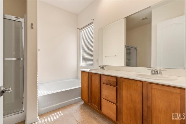 bathroom with vanity, independent shower and bath, and tile patterned flooring