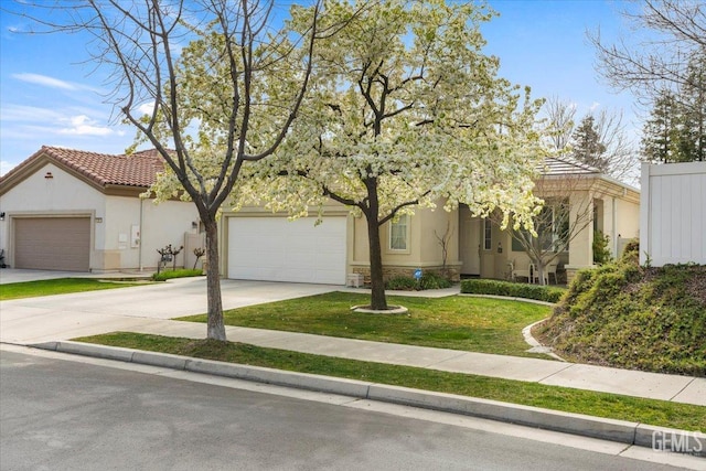 view of front facade with a garage and a front yard