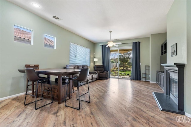 dining area featuring ceiling fan and light hardwood / wood-style floors