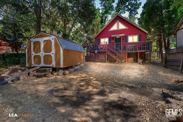 view of front of property with a wooden deck