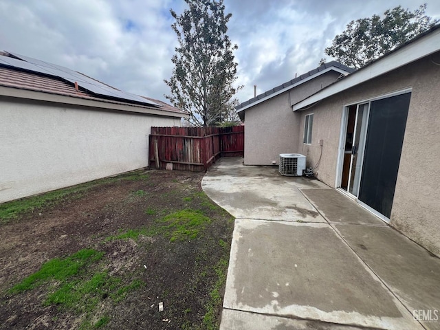 view of yard featuring central AC unit and a patio