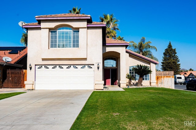 mediterranean / spanish-style home featuring a front yard and a garage