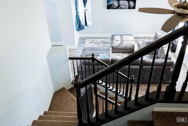 stairway featuring hardwood / wood-style floors