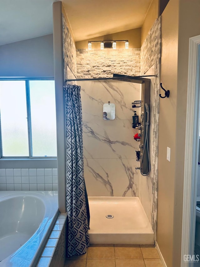 bathroom featuring tile patterned floors, toilet, vaulted ceiling, and a shower with shower curtain