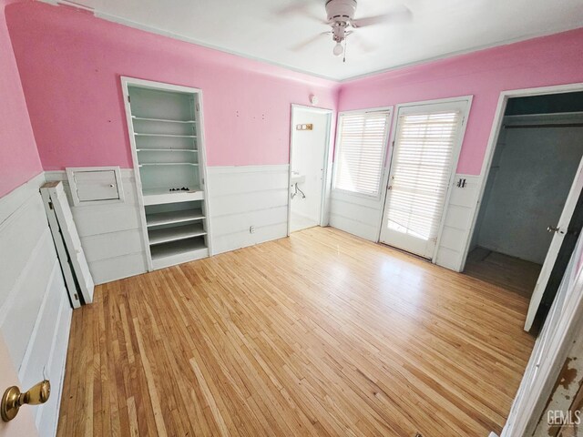 2313 Alturas Dr, Bakersfield, CA 93305 - unfurnished bedroom featuring wainscoting and wood finished floors