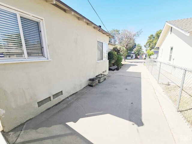 2313 Alturas Dr, Bakersfield, CA 93305 - view of property exterior featuring stucco siding and a patio