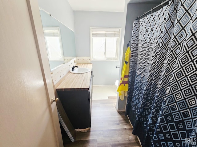 2313 Alturas Dr, Bakersfield, CA 93305 - full bath featuring wood finished floors and vanity