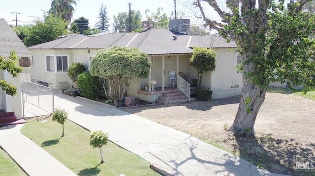 2313 Alturas Dr, Bakersfield, CA 93305 - view of front of home featuring roof with shingles and stucco siding