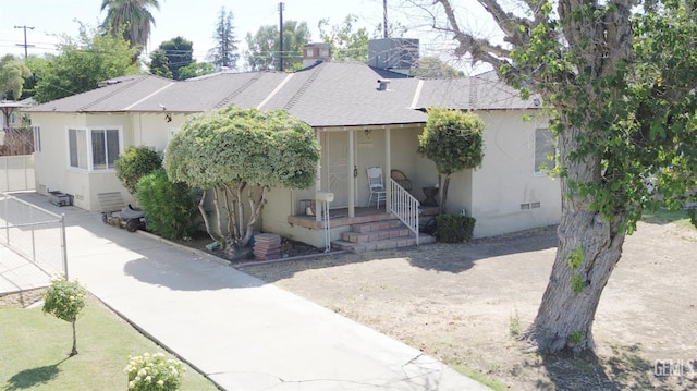 2313 Alturas Dr, Bakersfield, CA 93305 - view of front of home featuring stucco siding and a shingled roof