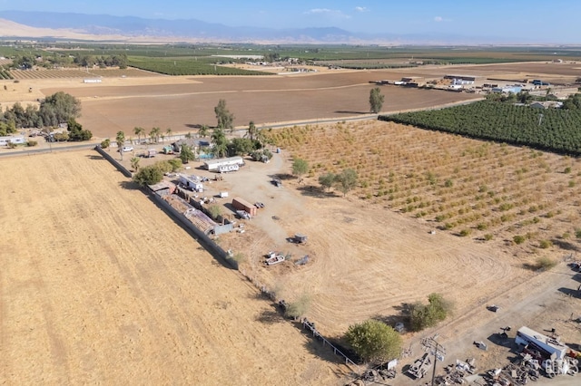 drone / aerial view featuring a mountain view and a rural view