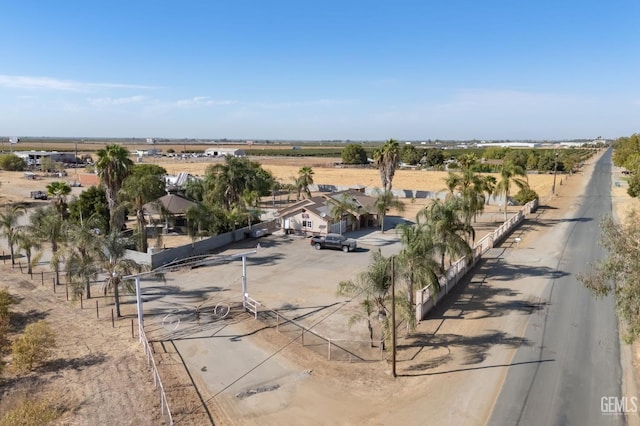 birds eye view of property with a rural view