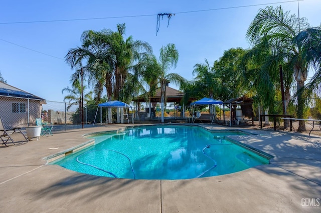 view of pool with a gazebo and a patio