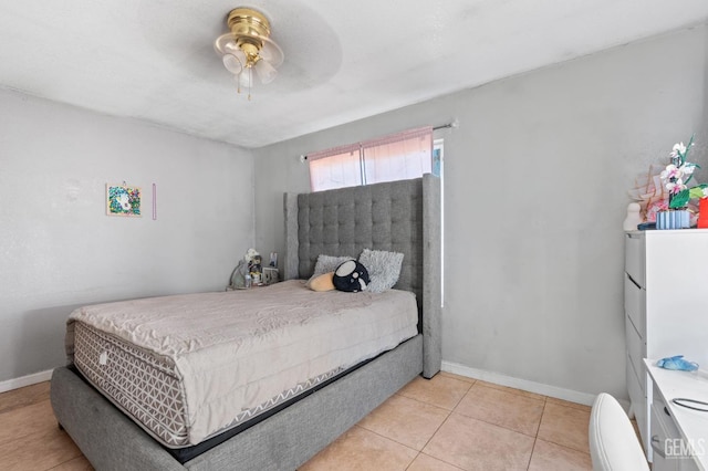 bedroom with ceiling fan and light tile patterned flooring