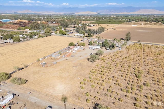 drone / aerial view featuring a mountain view and a rural view