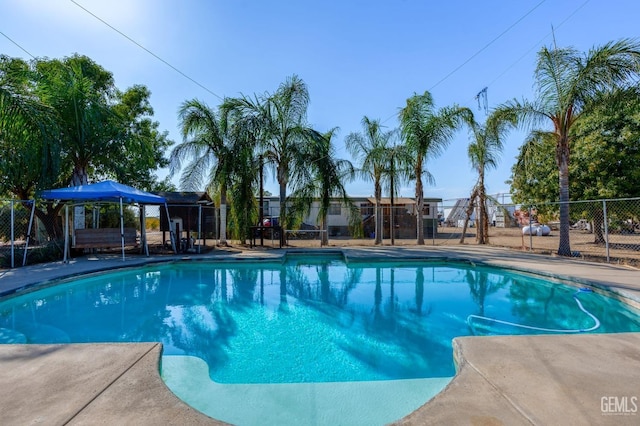 view of swimming pool featuring a patio