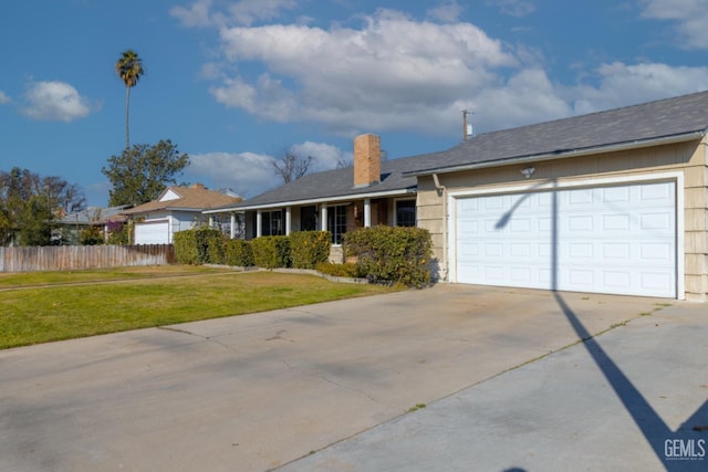 single story home with a front yard and a garage