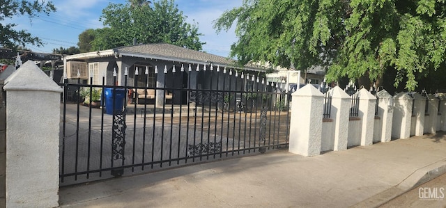 view of gate featuring a fenced front yard