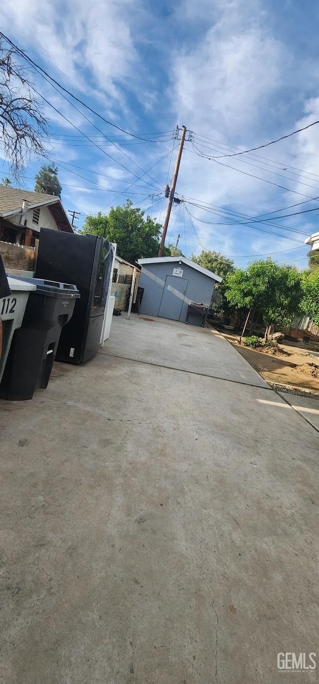 garage with concrete driveway