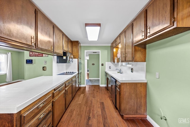 kitchen featuring dark hardwood / wood-style floors, sink, and stainless steel appliances