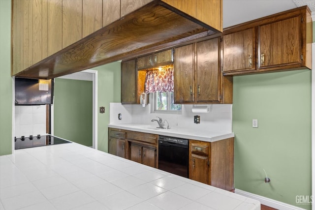 kitchen with sink, tasteful backsplash, ventilation hood, tile countertops, and black appliances