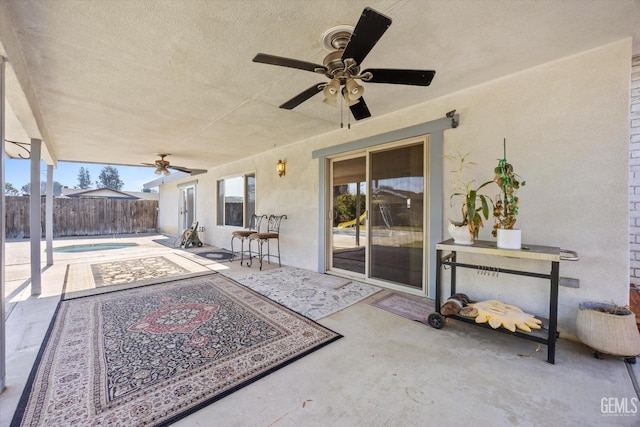 view of patio with a fenced in pool