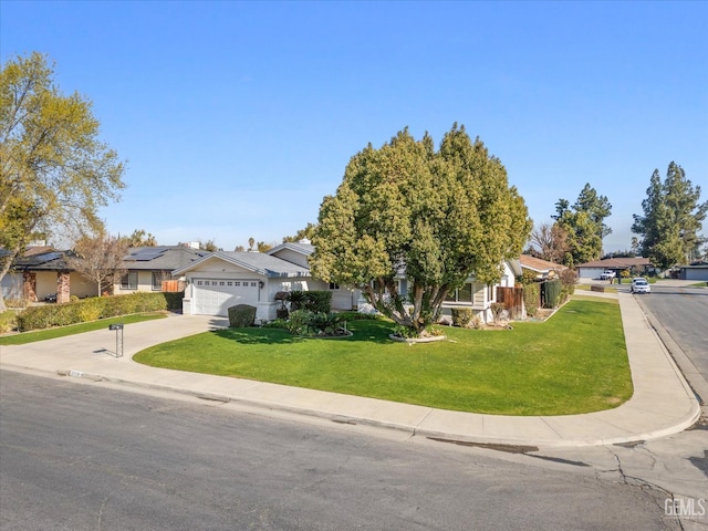 view of front of home with a garage and a front yard