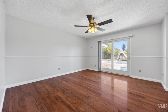 spare room with ceiling fan, dark hardwood / wood-style flooring, and a textured ceiling