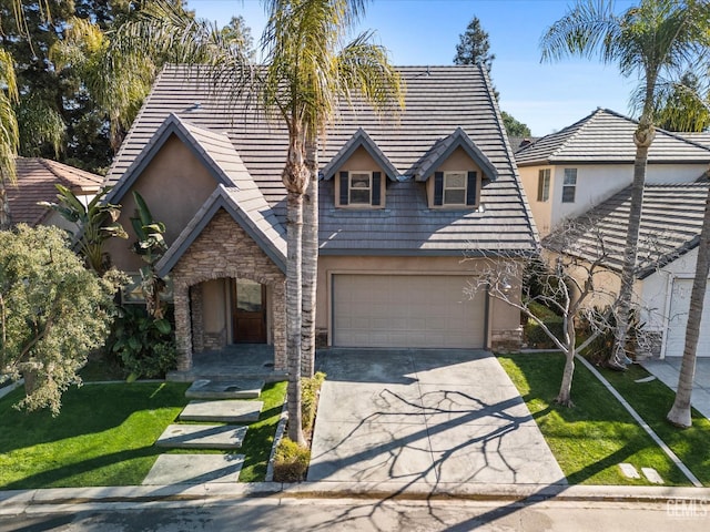 view of front facade with a garage and a front lawn