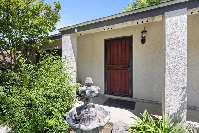 808 La Puente Dr, Bakersfield, CA 93309 - property entrance with stucco siding