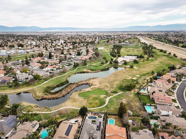 birds eye view of property featuring a residential view, golf course view, and a water and mountain view