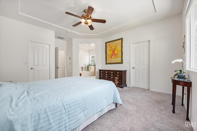 231 Port Logan Dr, Bakersfield, CA 93312 - bedroom with carpet, a tray ceiling, a ceiling fan, and ensuite bath