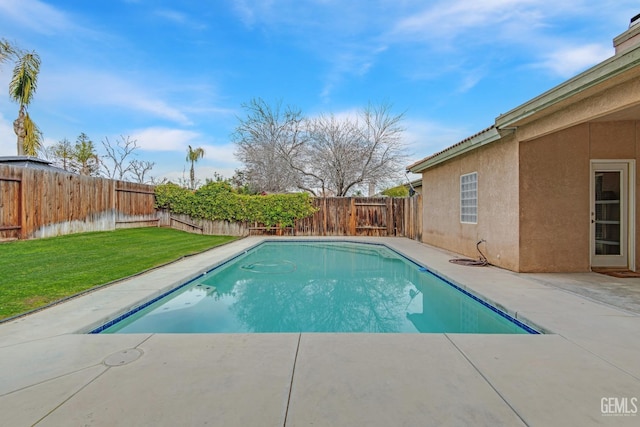 view of pool with a fenced in pool, a patio area, a fenced backyard, and a lawn