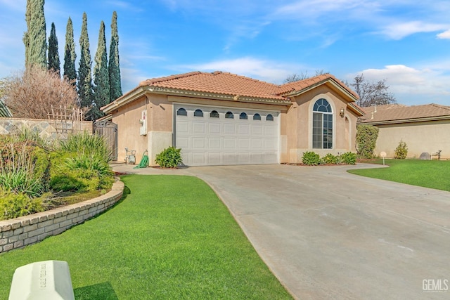 mediterranean / spanish-style house with driveway, a front lawn, an attached garage, and stucco siding