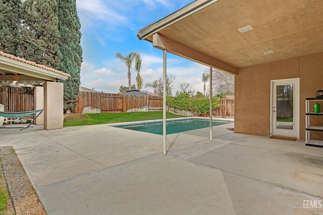 view of pool featuring a patio area, a fenced backyard, and a fenced in pool