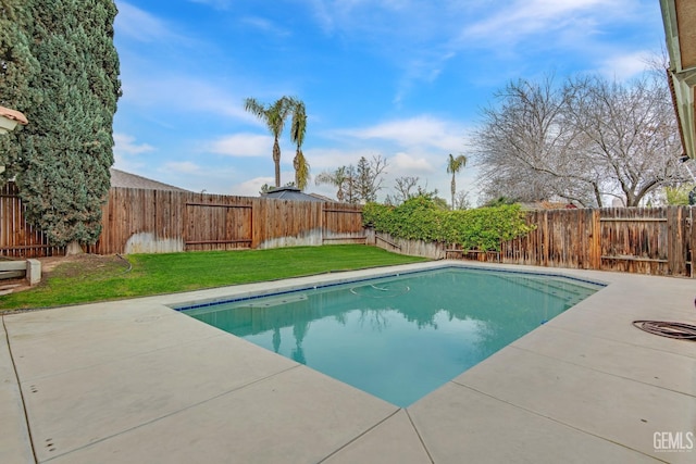 view of pool with a yard, a patio, a fenced backyard, and a fenced in pool