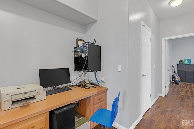 office featuring dark wood-type flooring and baseboards