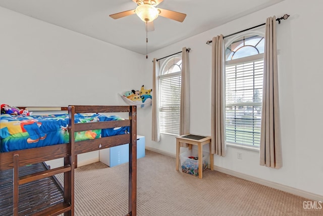 bedroom featuring carpet floors, ceiling fan, and baseboards