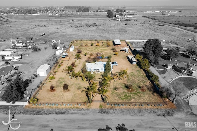 birds eye view of property featuring a rural view