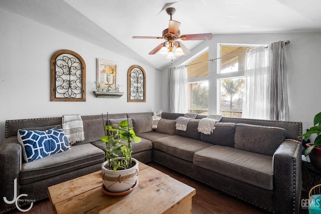 living room with ceiling fan, lofted ceiling, and dark wood-type flooring