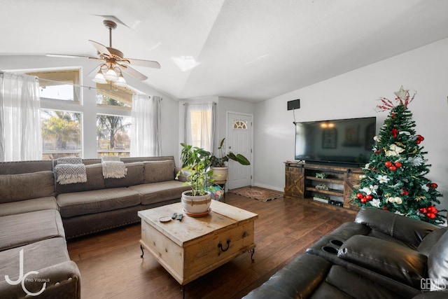 living room with ceiling fan, dark wood-type flooring, and lofted ceiling