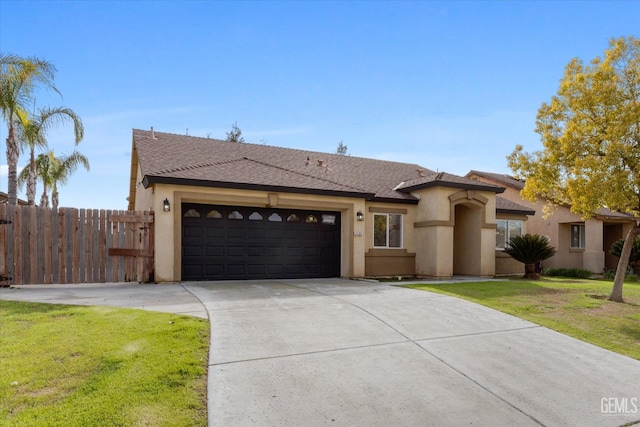 view of front facade featuring a garage and a front lawn