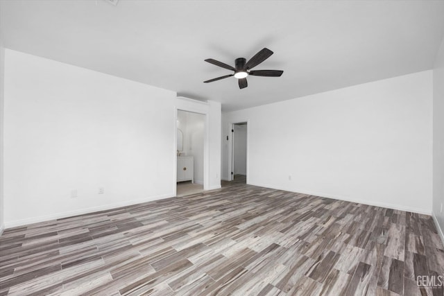 unfurnished bedroom with ceiling fan and light wood-type flooring