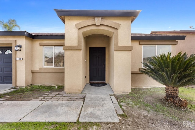 doorway to property featuring a garage