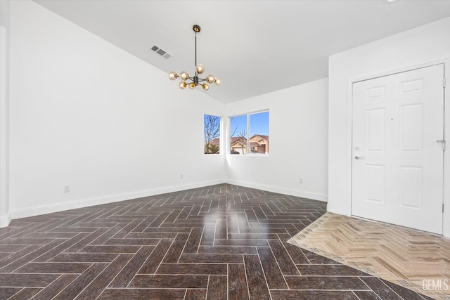 unfurnished room featuring an inviting chandelier, vaulted ceiling, and dark parquet floors