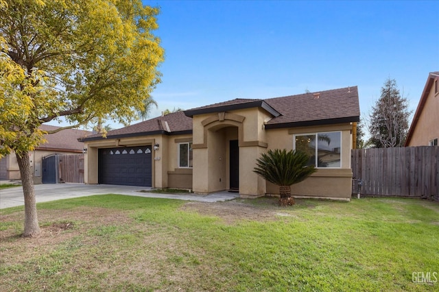 view of front of home with a garage and a front yard